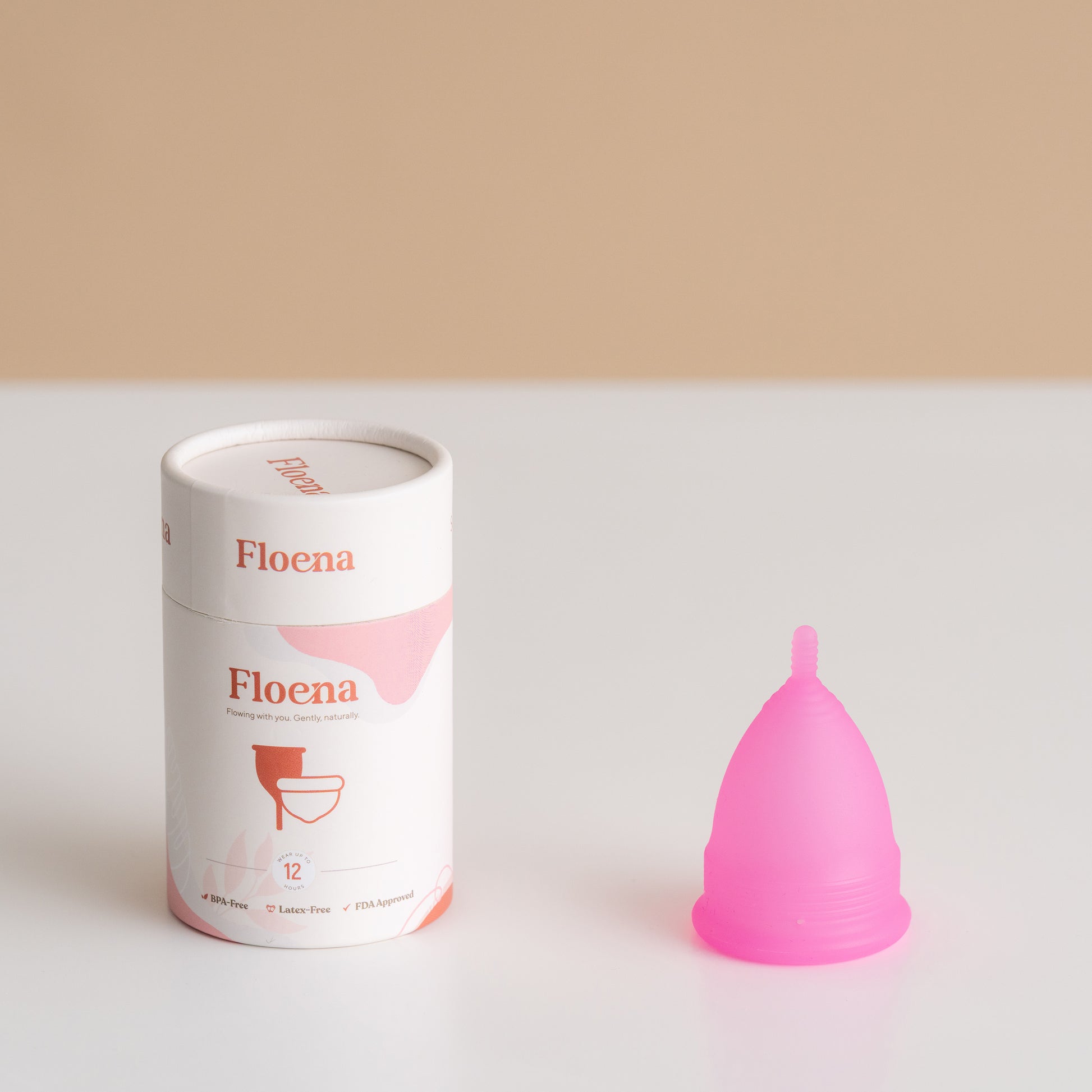 Floena Menstrual Cup in pink color, made of soft medical-grade silicone. Provides up to 12 hours of leakproof protection, ideal for comfortable wear during swimming, sleep, or daily activities.