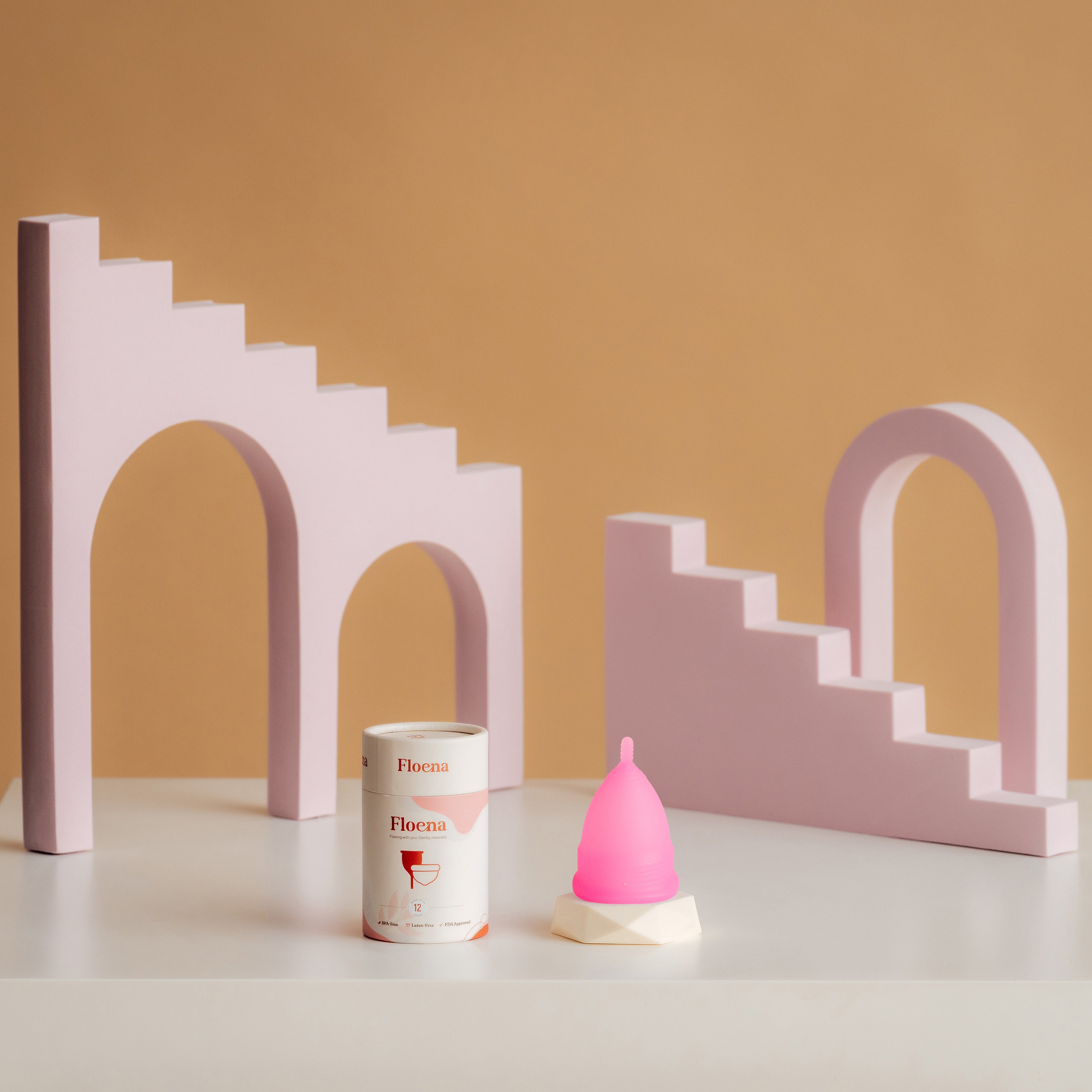 Floena Menstrual Cup in pink with protective case. The cup is designed for 12 hours of leakproof protection and made from medical-grade silicone for comfort and secure fit. Ideal for all-day wear.