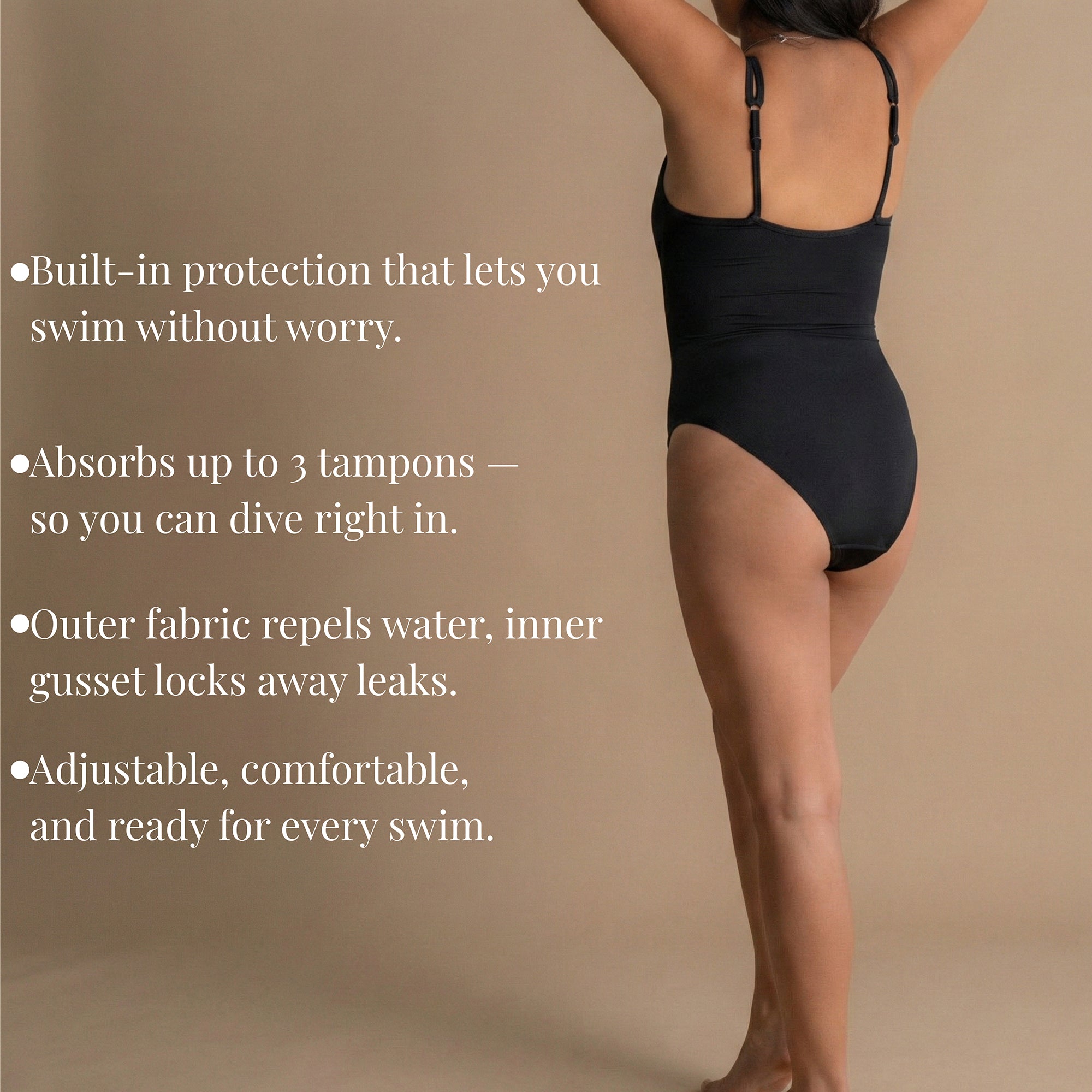 Full body back view of the model wearing a black Leakproof Period One-Piece Swimsuit. The model is standing confidently with a relaxed pose. This swimsuit offers built-in protection, absorbing up to 3 tampons, making it ideal for swimming, diving, and enjoying water activities. The outer fabric repels water, and the inner gusset locks away leaks for comfort and confidence.